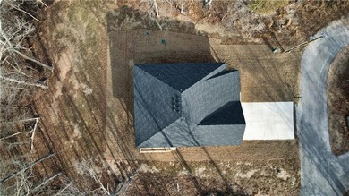 This inviting new construction Bella Vista home sits in a prime on Branchwood Golf Course in Arkansas - for sale on GolfHomes.com, golf home, golf lot