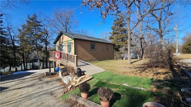 Welcome to your serene lakeside retreat! This beautiful property on Sugar Valley Lakes Golf Course in Kansas - for sale on GolfHomes.com, golf home, golf lot