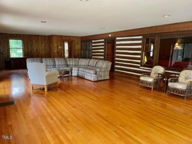 No need to go the mountains!! This  picturesque original log on Carolina Trace Country Club in North Carolina - for sale on GolfHomes.com, golf home, golf lot
