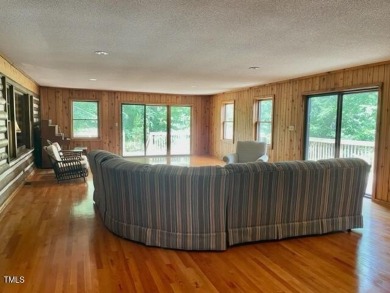 No need to go the mountains!! This  picturesque original log on Carolina Trace Country Club in North Carolina - for sale on GolfHomes.com, golf home, golf lot