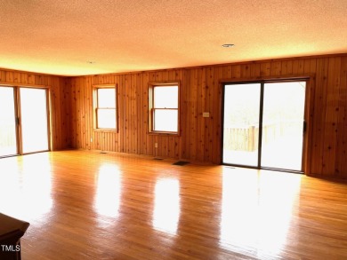No need to go the mountains!! This  picturesque original log on Carolina Trace Country Club in North Carolina - for sale on GolfHomes.com, golf home, golf lot