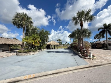 Prime Lakefront Lot on *Millionaire's Row* - Fully Furnished! on Motorcoach Resort Golf Course in Florida - for sale on GolfHomes.com, golf home, golf lot