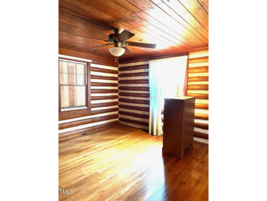 No need to go the mountains!! This  picturesque original log on Carolina Trace Country Club in North Carolina - for sale on GolfHomes.com, golf home, golf lot