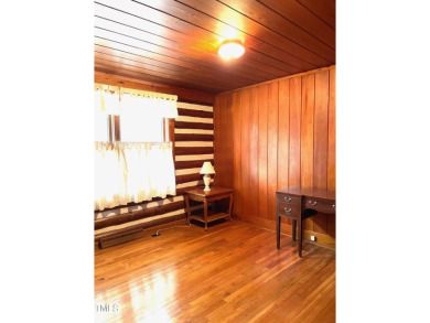 No need to go the mountains!! This  picturesque original log on Carolina Trace Country Club in North Carolina - for sale on GolfHomes.com, golf home, golf lot