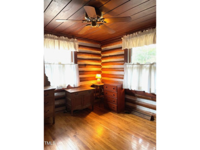 No need to go the mountains!! This  picturesque original log on Carolina Trace Country Club in North Carolina - for sale on GolfHomes.com, golf home, golf lot
