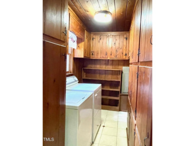 No need to go the mountains!! This  picturesque original log on Carolina Trace Country Club in North Carolina - for sale on GolfHomes.com, golf home, golf lot