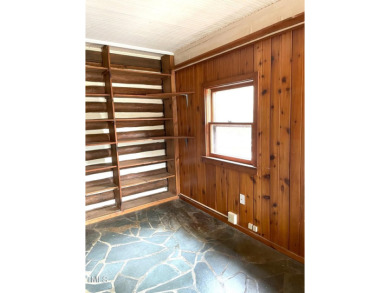No need to go the mountains!! This  picturesque original log on Carolina Trace Country Club in North Carolina - for sale on GolfHomes.com, golf home, golf lot