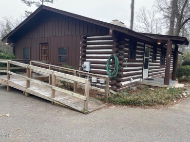 No need to go the mountains!! This  picturesque original log on Carolina Trace Country Club in North Carolina - for sale on GolfHomes.com, golf home, golf lot