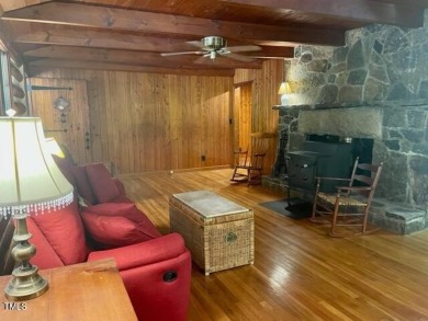 No need to go the mountains!! This  picturesque original log on Carolina Trace Country Club in North Carolina - for sale on GolfHomes.com, golf home, golf lot