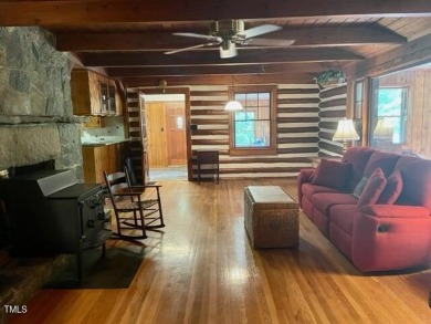 No need to go the mountains!! This  picturesque original log on Carolina Trace Country Club in North Carolina - for sale on GolfHomes.com, golf home, golf lot
