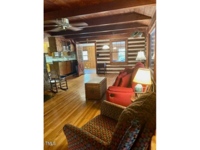 No need to go the mountains!! This  picturesque original log on Carolina Trace Country Club in North Carolina - for sale on GolfHomes.com, golf home, golf lot