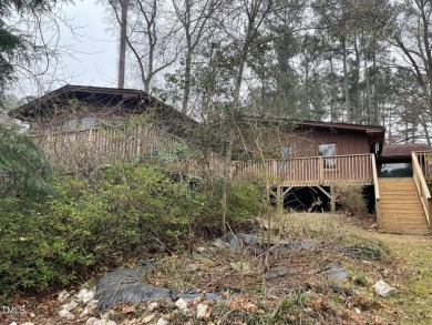 No need to go the mountains!! This  picturesque original log on Carolina Trace Country Club in North Carolina - for sale on GolfHomes.com, golf home, golf lot