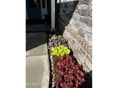 Better than new and truly turnkey, this exceptional ZERO-ENTRY on Toqua Golf Course - Loudon County in Tennessee - for sale on GolfHomes.com, golf home, golf lot