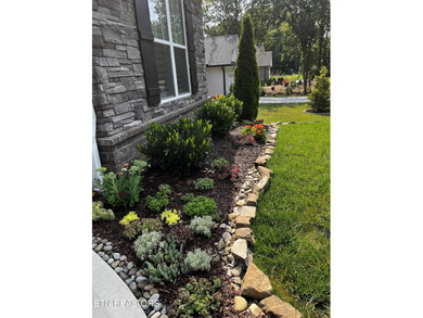 Better than new and truly turnkey, this exceptional ZERO-ENTRY on Toqua Golf Course - Loudon County in Tennessee - for sale on GolfHomes.com, golf home, golf lot