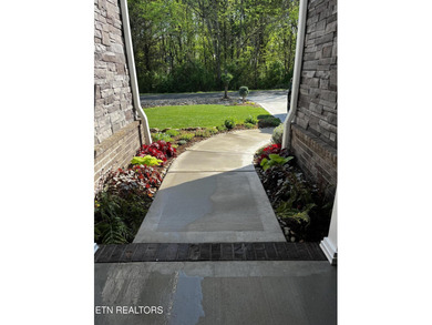 Better than new and truly turnkey, this exceptional ZERO-ENTRY on Toqua Golf Course - Loudon County in Tennessee - for sale on GolfHomes.com, golf home, golf lot