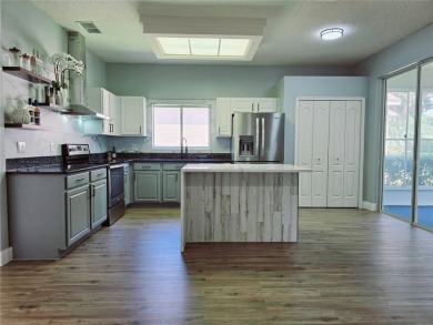 Under contract-accepting backup offers. One or more photo(s) has on Kings Ridge Golf Club in Florida - for sale on GolfHomes.com, golf home, golf lot