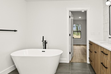This stunning new home combines quality craftsmanship with on Bill and Payne Stewart Golf Course  in Missouri - for sale on GolfHomes.com, golf home, golf lot