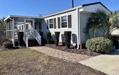 This charming 2-bedroom, 1-bathroom mobile home offers the on Barefoot Resort and Golf Club  in South Carolina - for sale on GolfHomes.com, golf home, golf lot