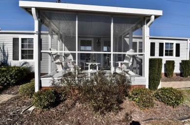 This charming 2-bedroom, 1-bathroom mobile home offers the on Barefoot Resort and Golf Club  in South Carolina - for sale on GolfHomes.com, golf home, golf lot