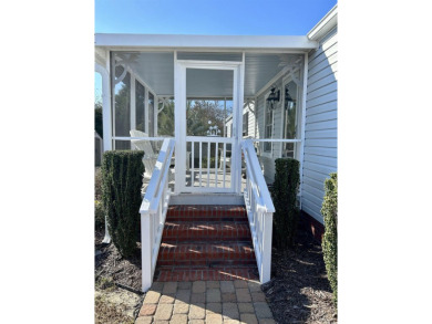This charming 2-bedroom, 1-bathroom mobile home offers the on Barefoot Resort and Golf Club  in South Carolina - for sale on GolfHomes.com, golf home, golf lot