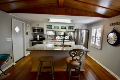 This charming 2-bedroom, 1-bathroom mobile home offers the on Barefoot Resort and Golf Club  in South Carolina - for sale on GolfHomes.com, golf home, golf lot