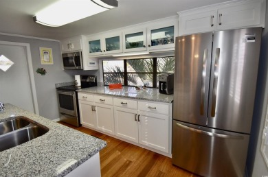 This charming 2-bedroom, 1-bathroom mobile home offers the on Barefoot Resort and Golf Club  in South Carolina - for sale on GolfHomes.com, golf home, golf lot