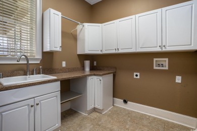 This custom-built 4-bedroom, 4.5-bathroom home sits on a corner on Long Bay Club in South Carolina - for sale on GolfHomes.com, golf home, golf lot