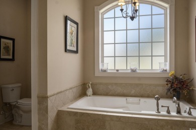 This custom-built 4-bedroom, 4.5-bathroom home sits on a corner on Long Bay Club in South Carolina - for sale on GolfHomes.com, golf home, golf lot