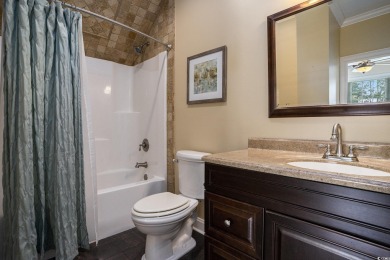 This custom-built 4-bedroom, 4.5-bathroom home sits on a corner on Long Bay Club in South Carolina - for sale on GolfHomes.com, golf home, golf lot