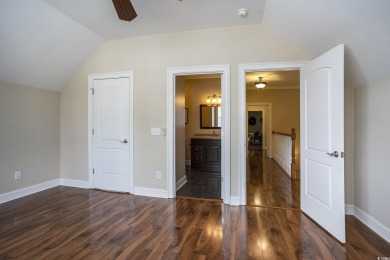 This custom-built 4-bedroom, 4.5-bathroom home sits on a corner on Long Bay Club in South Carolina - for sale on GolfHomes.com, golf home, golf lot