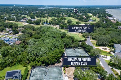 This immaculately maintained, custom-built home overlooks the on Shalimar Pointe Golf and Country Club in Florida - for sale on GolfHomes.com, golf home, golf lot