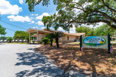 This immaculately maintained, custom-built home overlooks the on Shalimar Pointe Golf and Country Club in Florida - for sale on GolfHomes.com, golf home, golf lot