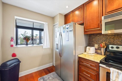This second floor corner unit is in a gated community on Feather Sound Country Club in Florida - for sale on GolfHomes.com, golf home, golf lot