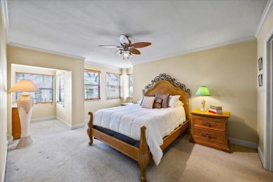 This second floor corner unit is in a gated community on Feather Sound Country Club in Florida - for sale on GolfHomes.com, golf home, golf lot