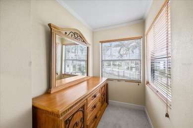 This second floor corner unit is in a gated community on Feather Sound Country Club in Florida - for sale on GolfHomes.com, golf home, golf lot