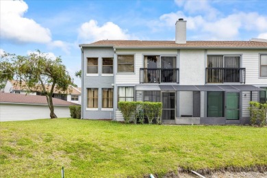 This second floor corner unit is in a gated community on Feather Sound Country Club in Florida - for sale on GolfHomes.com, golf home, golf lot