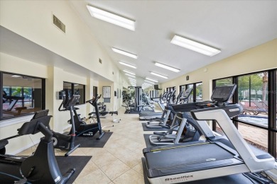 This second floor corner unit is in a gated community on Feather Sound Country Club in Florida - for sale on GolfHomes.com, golf home, golf lot