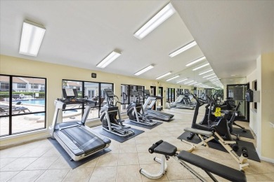 This second floor corner unit is in a gated community on Feather Sound Country Club in Florida - for sale on GolfHomes.com, golf home, golf lot