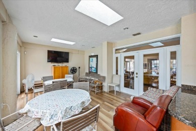 This second floor corner unit is in a gated community on Feather Sound Country Club in Florida - for sale on GolfHomes.com, golf home, golf lot