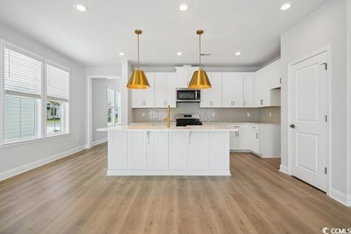 Fall in love with this 3-bedroom, 2.5-bath home in the heart of on Tidewater Golf Club and Plantation in South Carolina - for sale on GolfHomes.com, golf home, golf lot