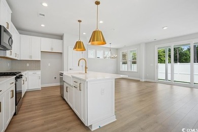 Fall in love with this 3-bedroom, 2.5-bath home in the heart of on Tidewater Golf Club and Plantation in South Carolina - for sale on GolfHomes.com, golf home, golf lot