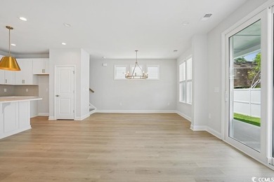 Fall in love with this 3-bedroom, 2.5-bath home in the heart of on Tidewater Golf Club and Plantation in South Carolina - for sale on GolfHomes.com, golf home, golf lot