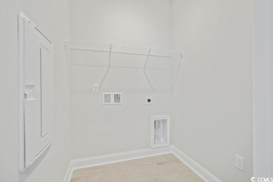 Fall in love with this 3-bedroom, 2.5-bath home in the heart of on Tidewater Golf Club and Plantation in South Carolina - for sale on GolfHomes.com, golf home, golf lot