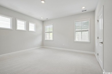 Fall in love with this 3-bedroom, 2.5-bath home in the heart of on Tidewater Golf Club and Plantation in South Carolina - for sale on GolfHomes.com, golf home, golf lot