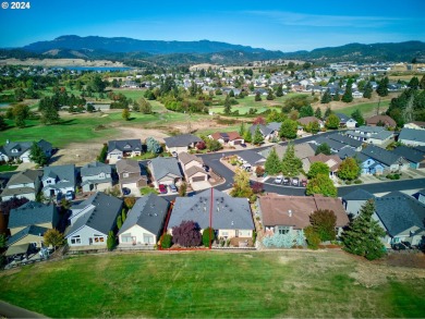 This exquisite single-level home boasts an open floorplan on Oak Hills Golf Club / Umpqua Golf Resort in Oregon - for sale on GolfHomes.com, golf home, golf lot