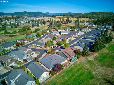 This exquisite single-level home boasts an open floorplan on Oak Hills Golf Club / Umpqua Golf Resort in Oregon - for sale on GolfHomes.com, golf home, golf lot