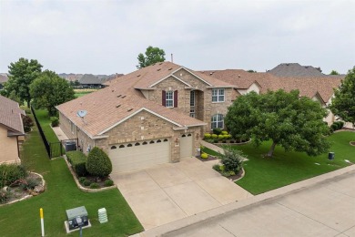 Experience the majestic two-story brick Ladera model, situated on Wildhorse Golf Club of Robson Ranch in Texas - for sale on GolfHomes.com, golf home, golf lot