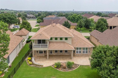 Experience the majestic two-story brick Ladera model, situated on Wildhorse Golf Club of Robson Ranch in Texas - for sale on GolfHomes.com, golf home, golf lot