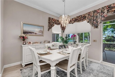 Enjoy breathtaking lake and golf course views from this on Monarch Country Club in Florida - for sale on GolfHomes.com, golf home, golf lot