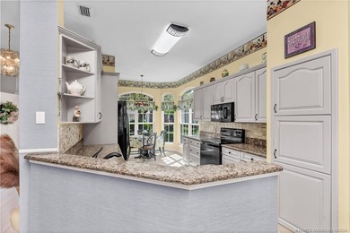 Enjoy breathtaking lake and golf course views from this on Monarch Country Club in Florida - for sale on GolfHomes.com, golf home, golf lot